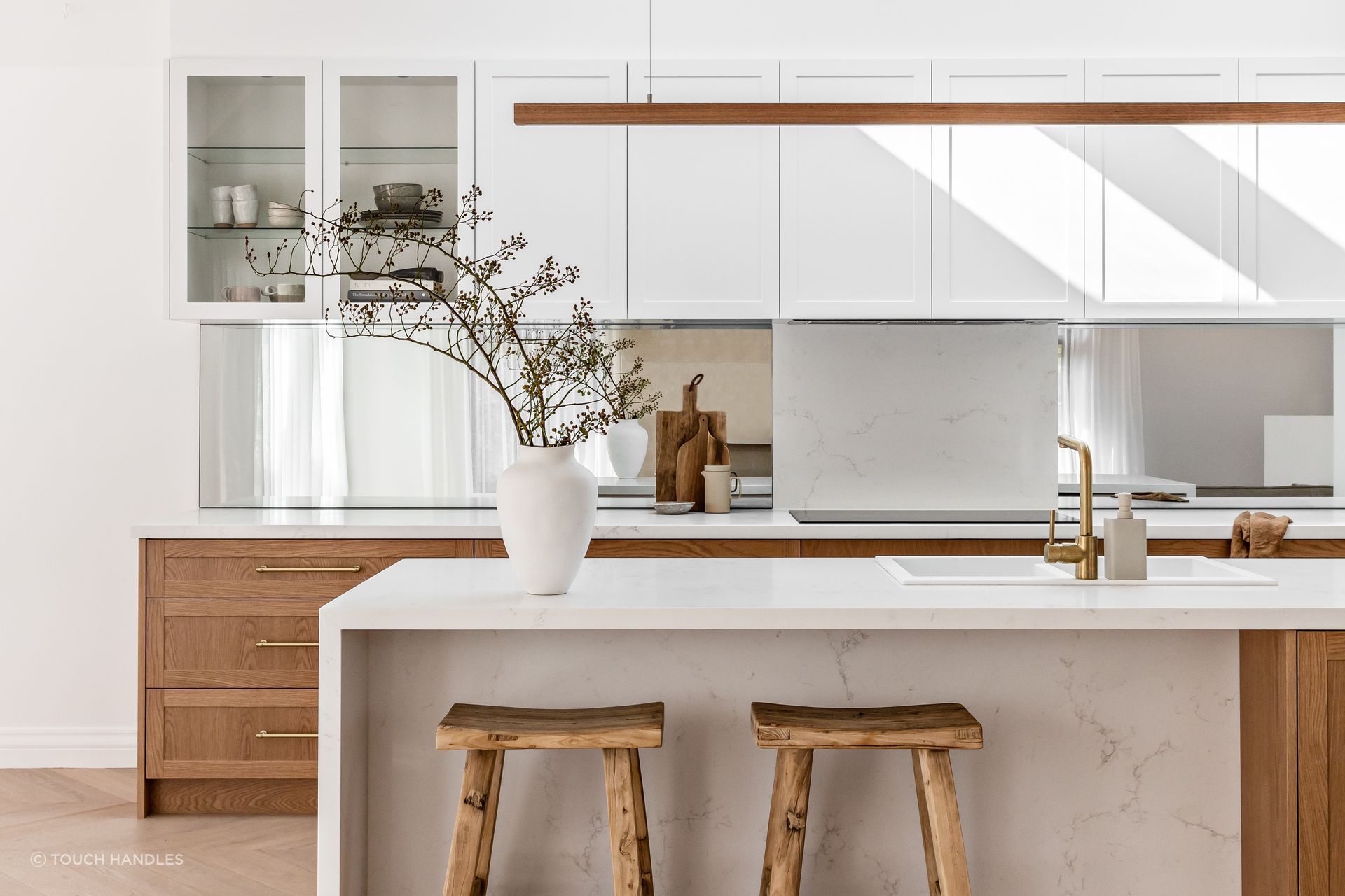 Sticking to one core colour with complementary accents is sometimes all that's needed as the stylish Spanish Mission Coogee Home kitchen shows - Photography: The Palm Co.