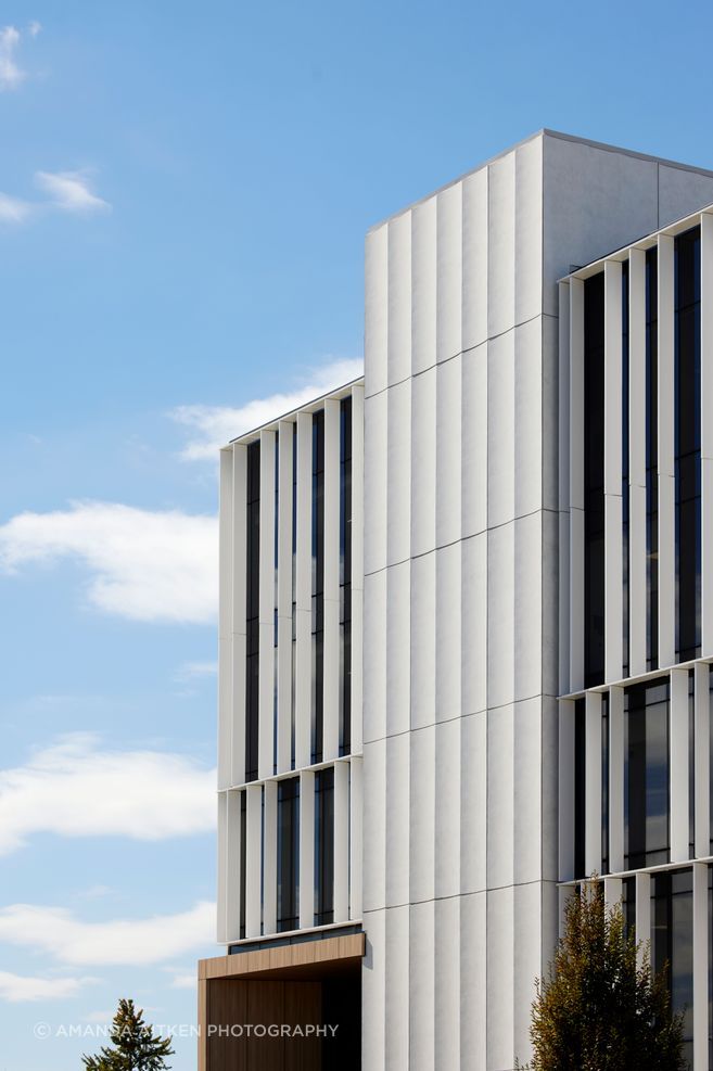 The exterior louvres are functional, carefully allowing natural light into the building's office spaces.