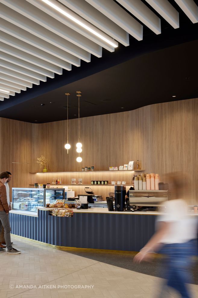Most tenants in the building do their own fit outs. The pendant lights in the cafe are by Nightworks Studio.