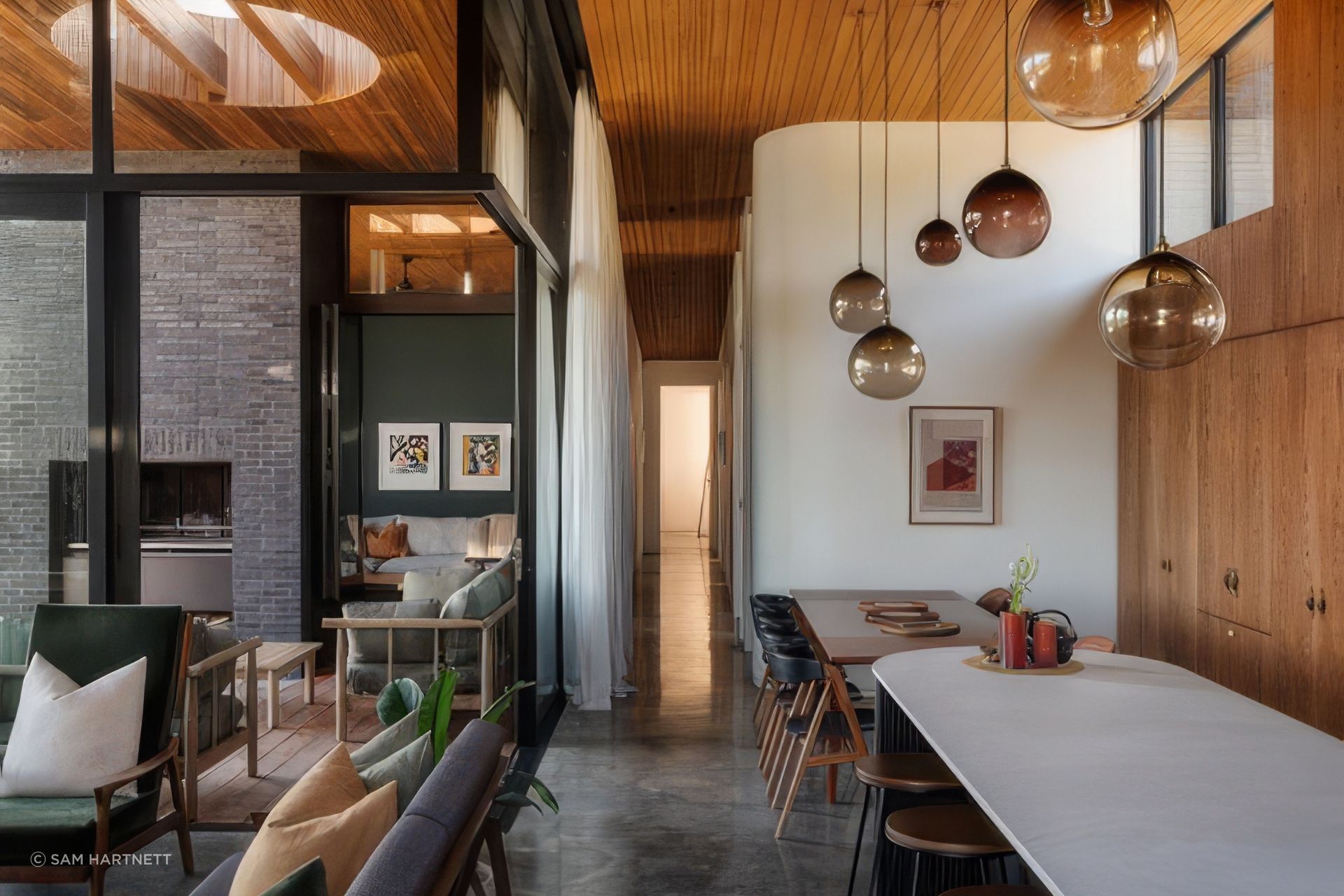 The home is beautifully refined yet equally expressive, revealing its character through curved details and textured materials.