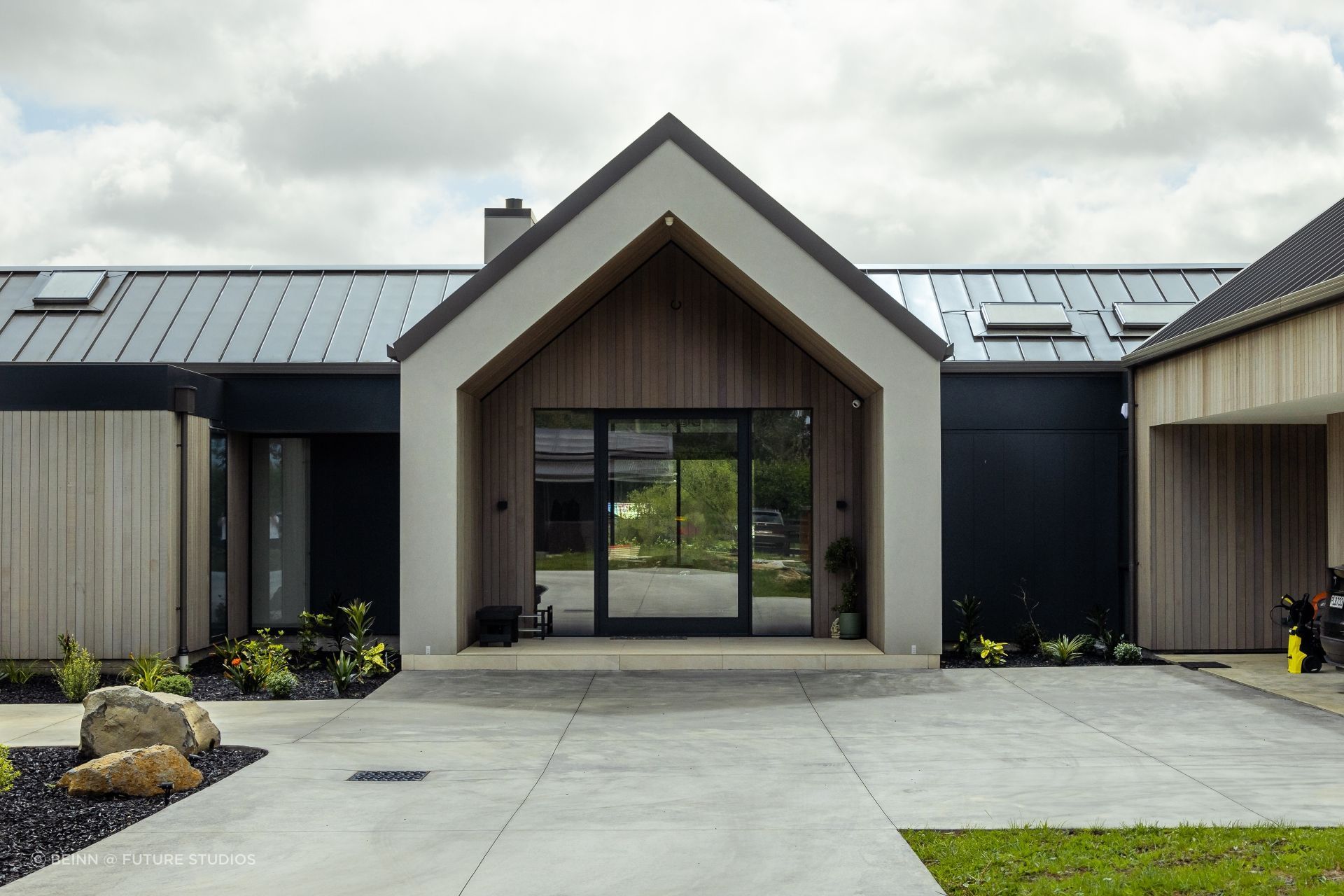 The forecourt features carefully considered planting.