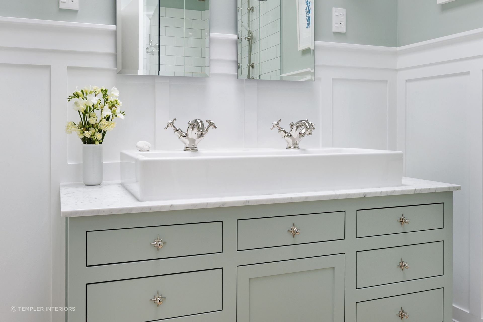 White wainscoting supported by superb furnishings gives a clean and polished look as seen in this Mt Eden villa renovation.