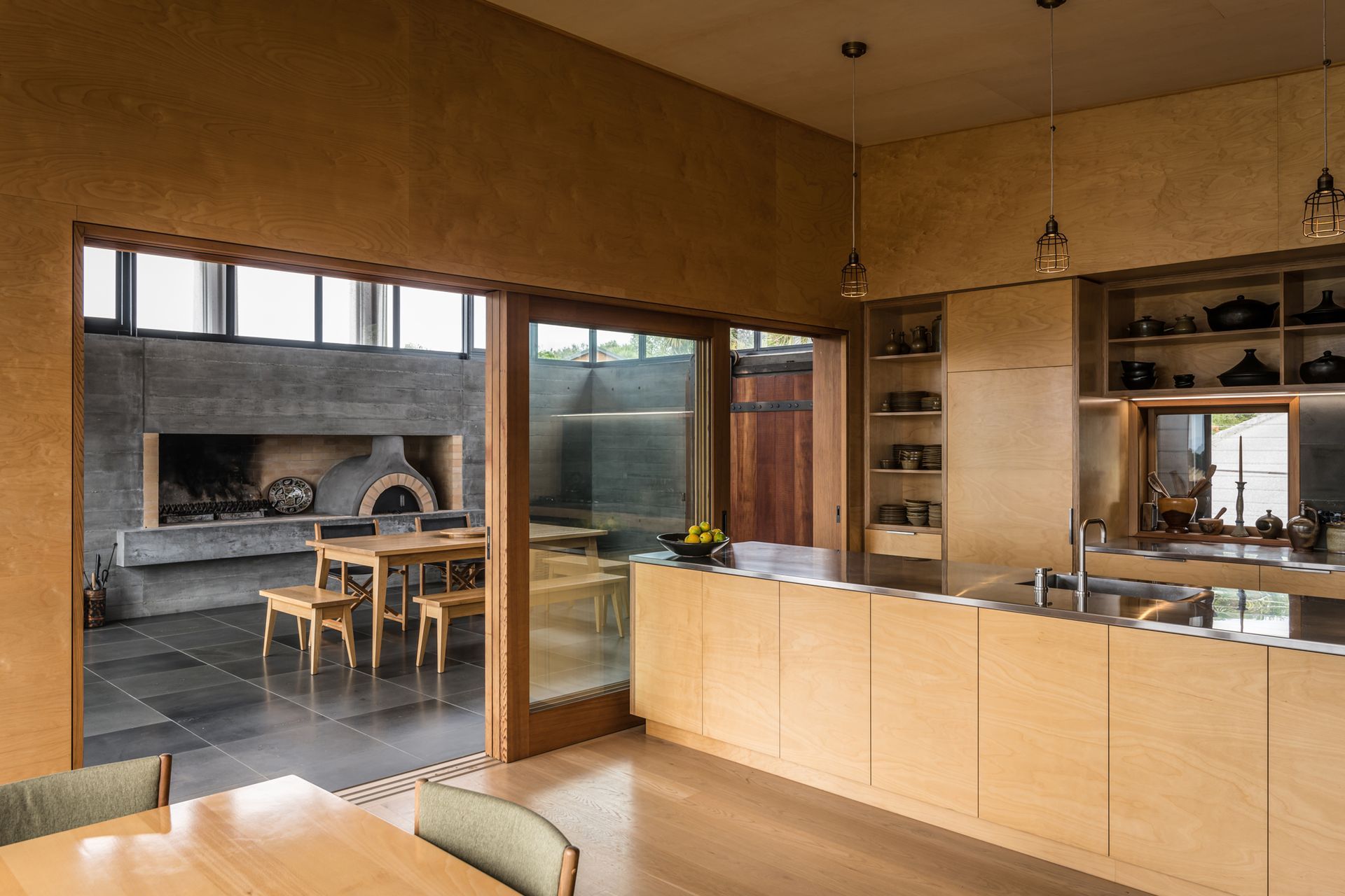 Mark is a big fan on the ‘pizza oven room’. “The detailing on that cedar sarking is really good, the basalt flooring is very practical, and the pizza oven and fire are used a lot,” he says.