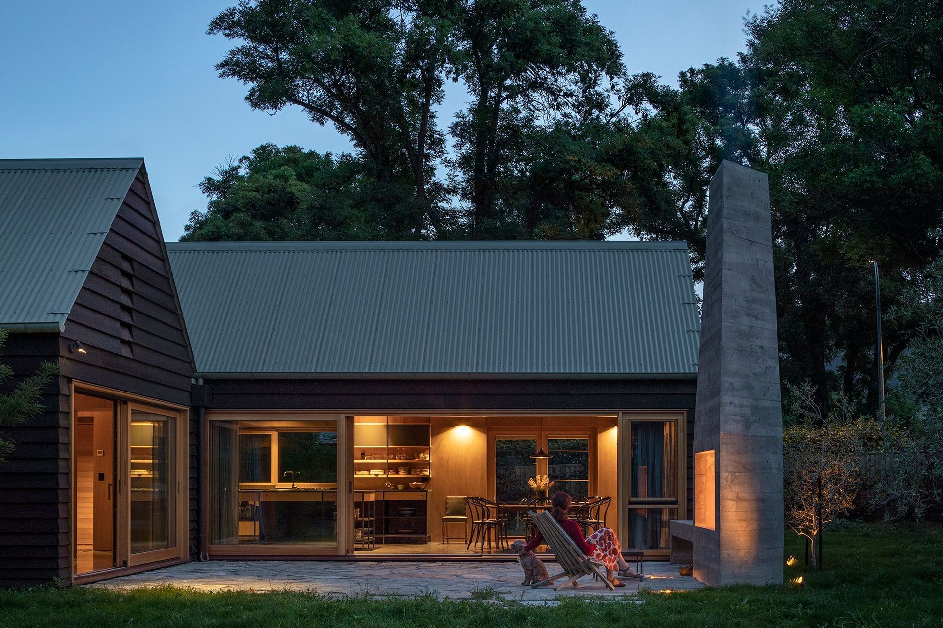 The main courtyard off the lounge (left) and the dining area (centre) has a large cast in-situ concrete fireplace for cooler nights.
