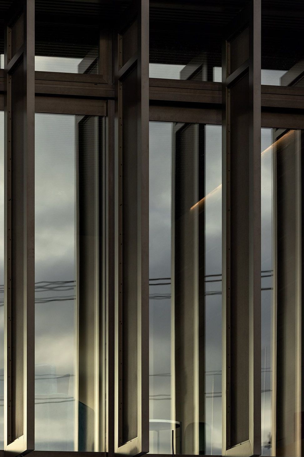 Perforated aluminium screens allow for differing levels of light to be achieved