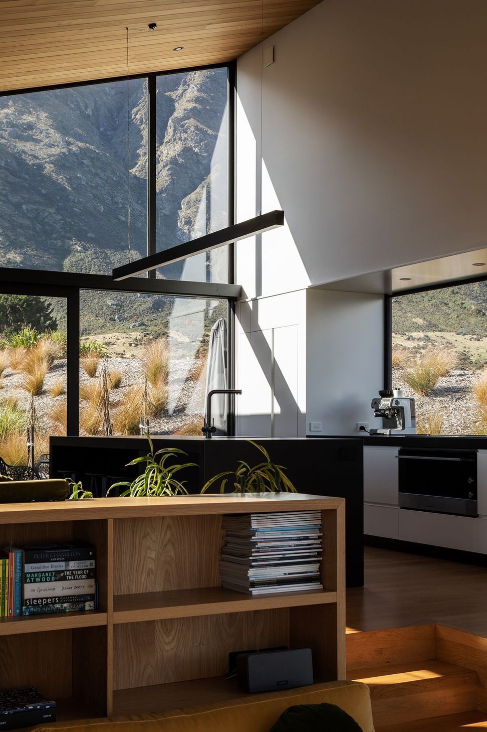 The lofty kitchen has mountain views in all directions, including through the pantry.