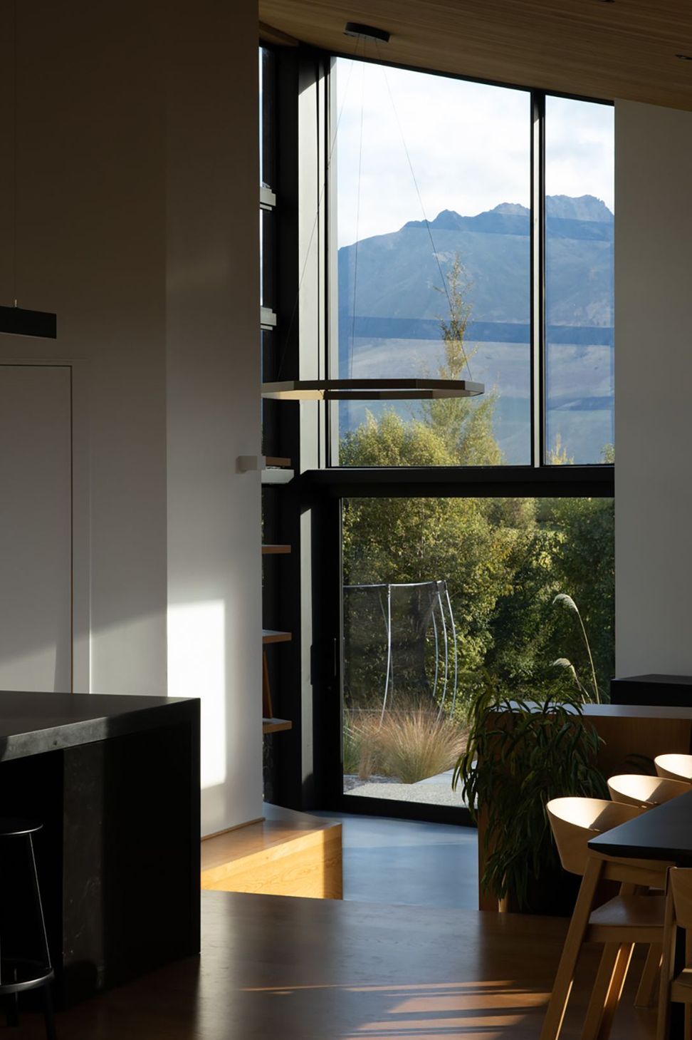 The pantry door on the left opens up with glazing to reveal a landscape view.