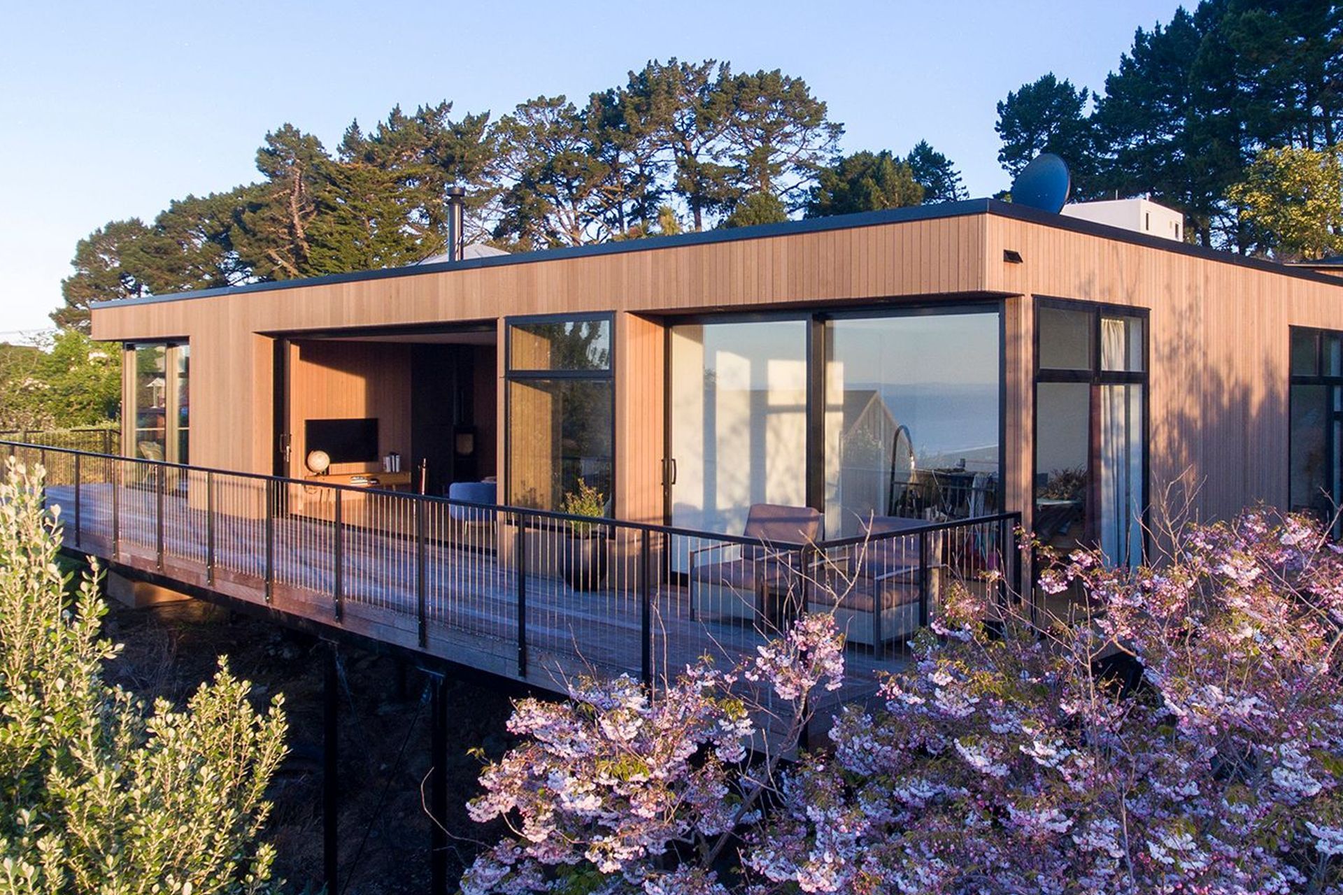 Mature cherry blossoms and fruit trees on the site have helped to quickly bed the new house into the surroundings.