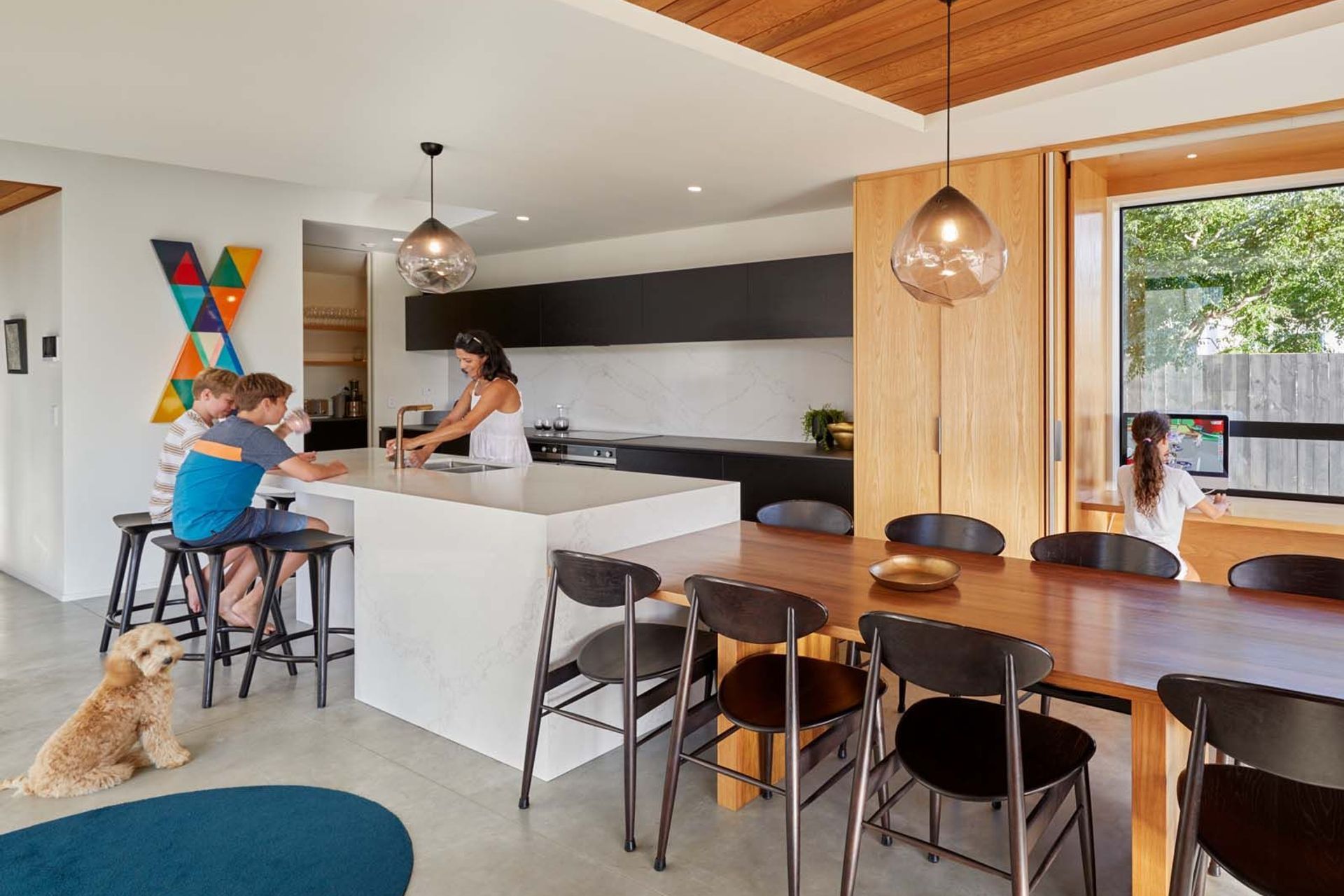 The practical kitchen is designed for family life and features a scullery at the back, which includes a utility and laundry area leading into the garage.