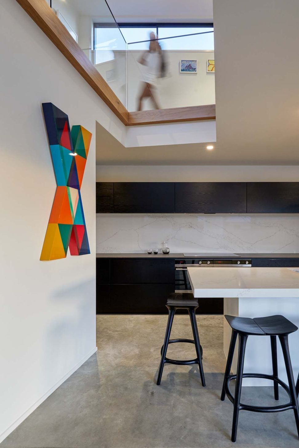 A lightwell over the kitchen draws in light and connects the kitchen with the upstairs.