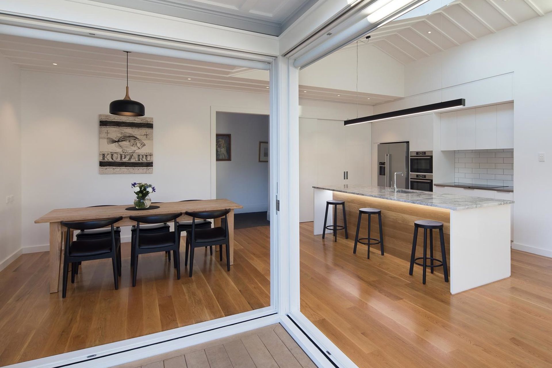 A clean, minimal aesthetic combined with removing internal and external walls realised an bright, open space.  