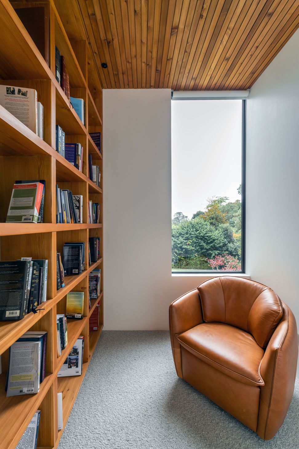 Full-height bookshelves were incorporated to house the owners' book collection. 