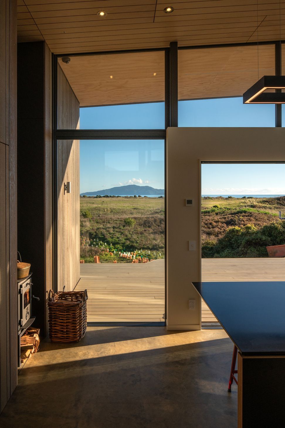 The west-facing deck enjoys plenty of sun while the concrete floor provides thermal mass ensuring the warmth gained during the day is slowly released at night.