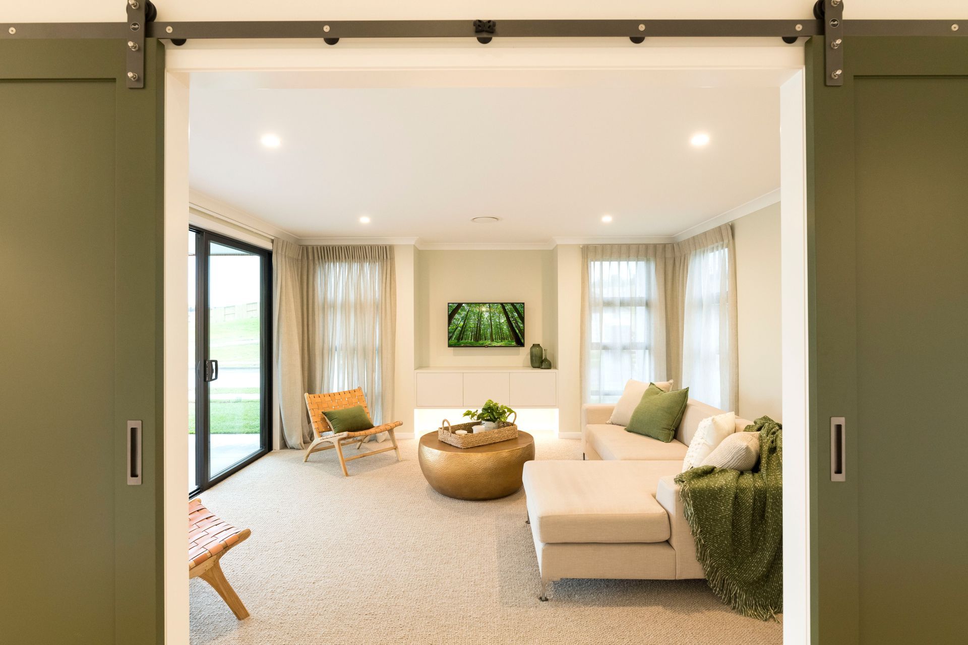 Dulux Mt Stevens barn doors leading into the formal lounge, James Dunlop sheer curtains, Cavalier Bremworth carpet