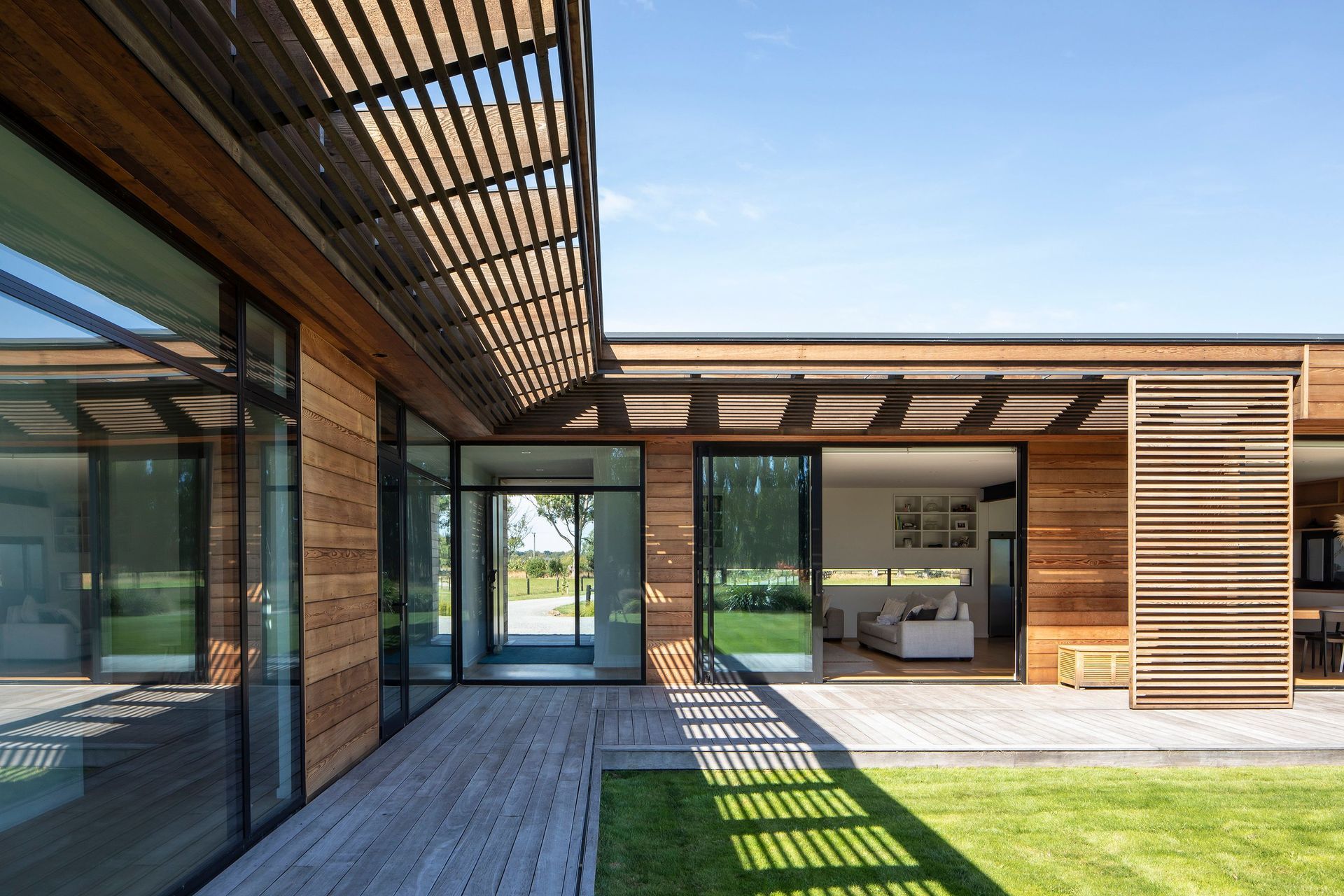 The verandah flows along the north–north-west facing edges of the house, providing areas of shade from the sun.