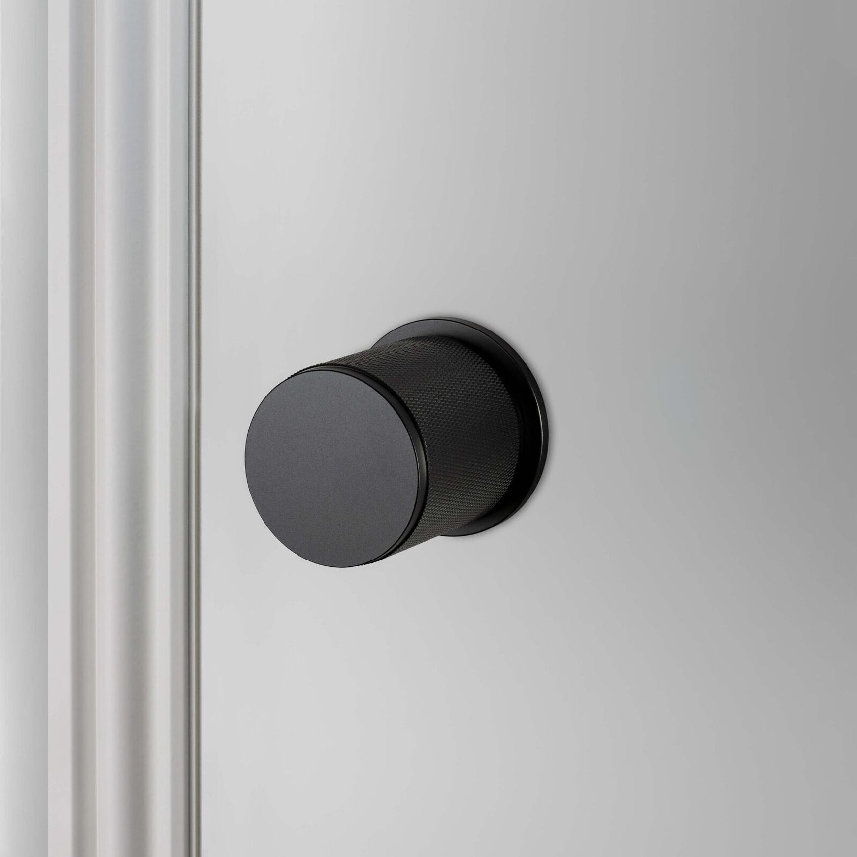 Buster and Punch Cross-Knurl Door Knob on Round Rose