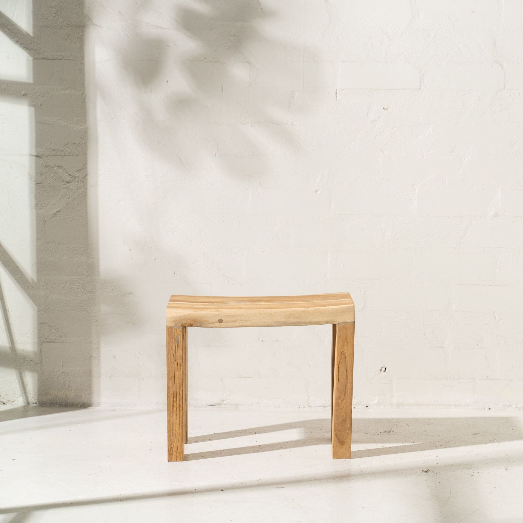 Talib Curved Stool in Rustic Finish
