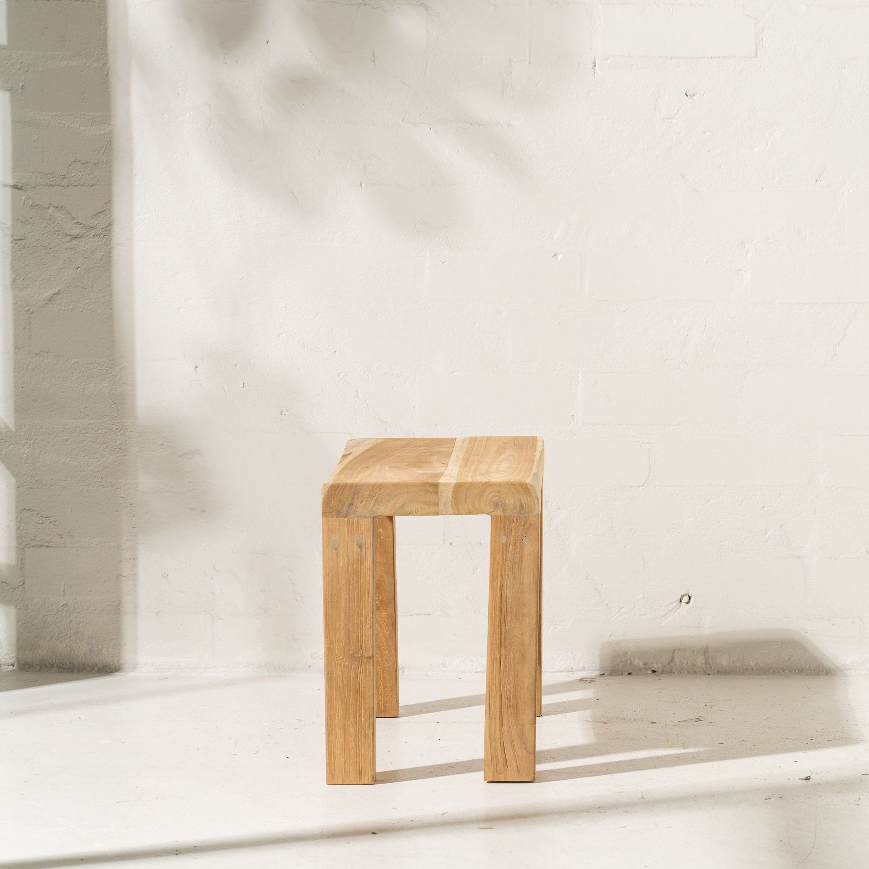Talib Curved Stool in Rustic Finish