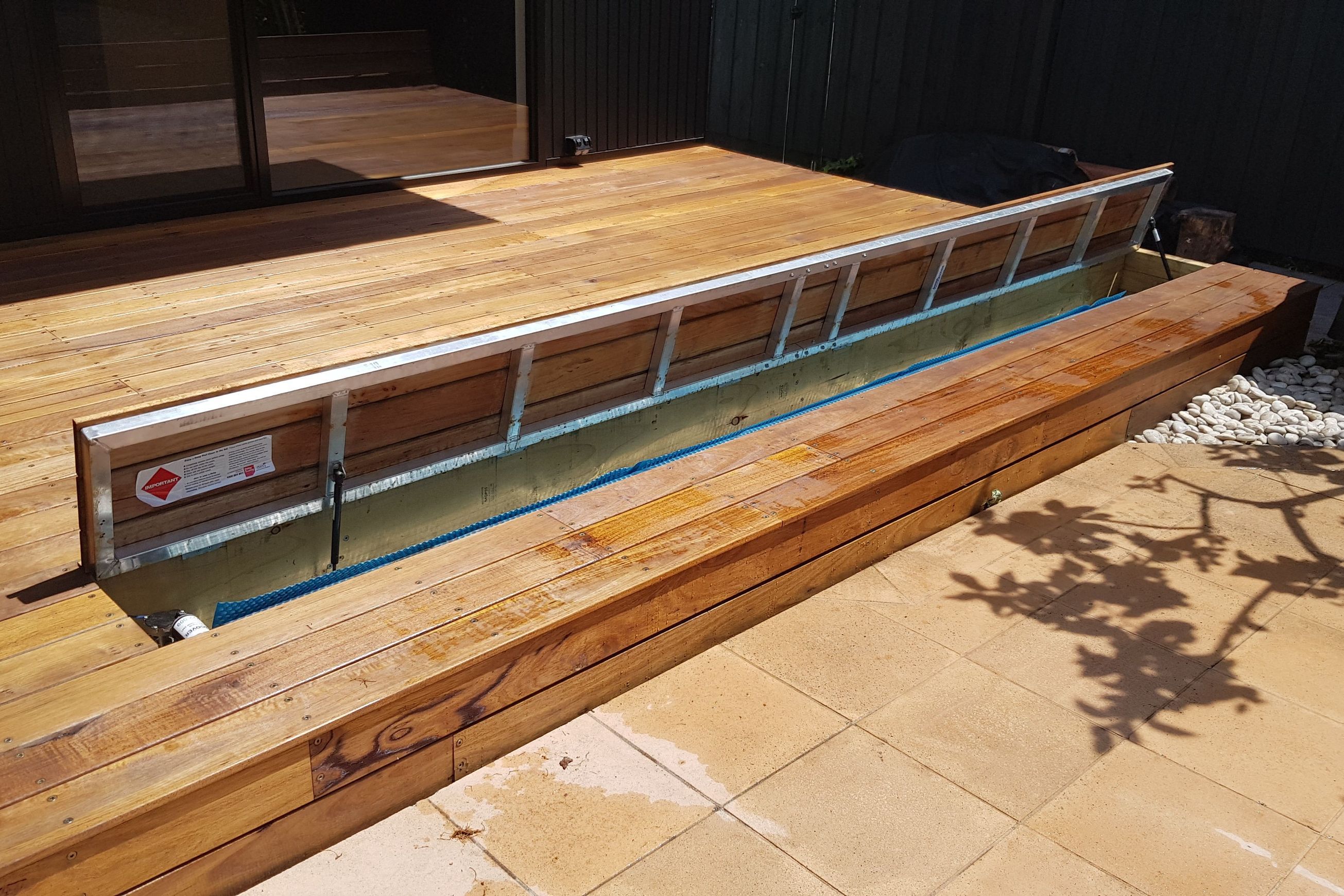 Under Deck UnderCover® Concealed Pool Cover - Powered