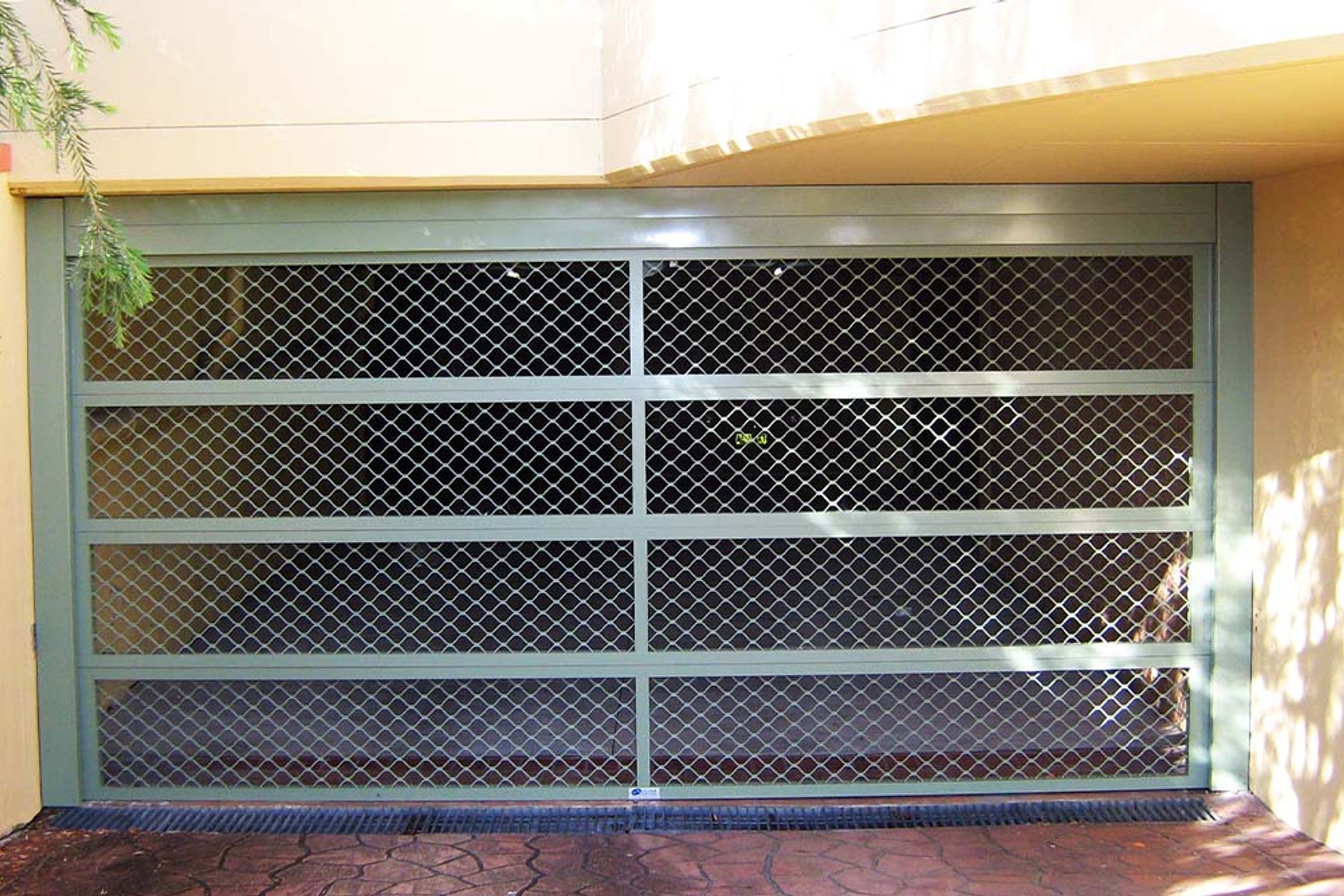 Security Mesh Sectional Aluminium Garage Doors | Specialty Doors
