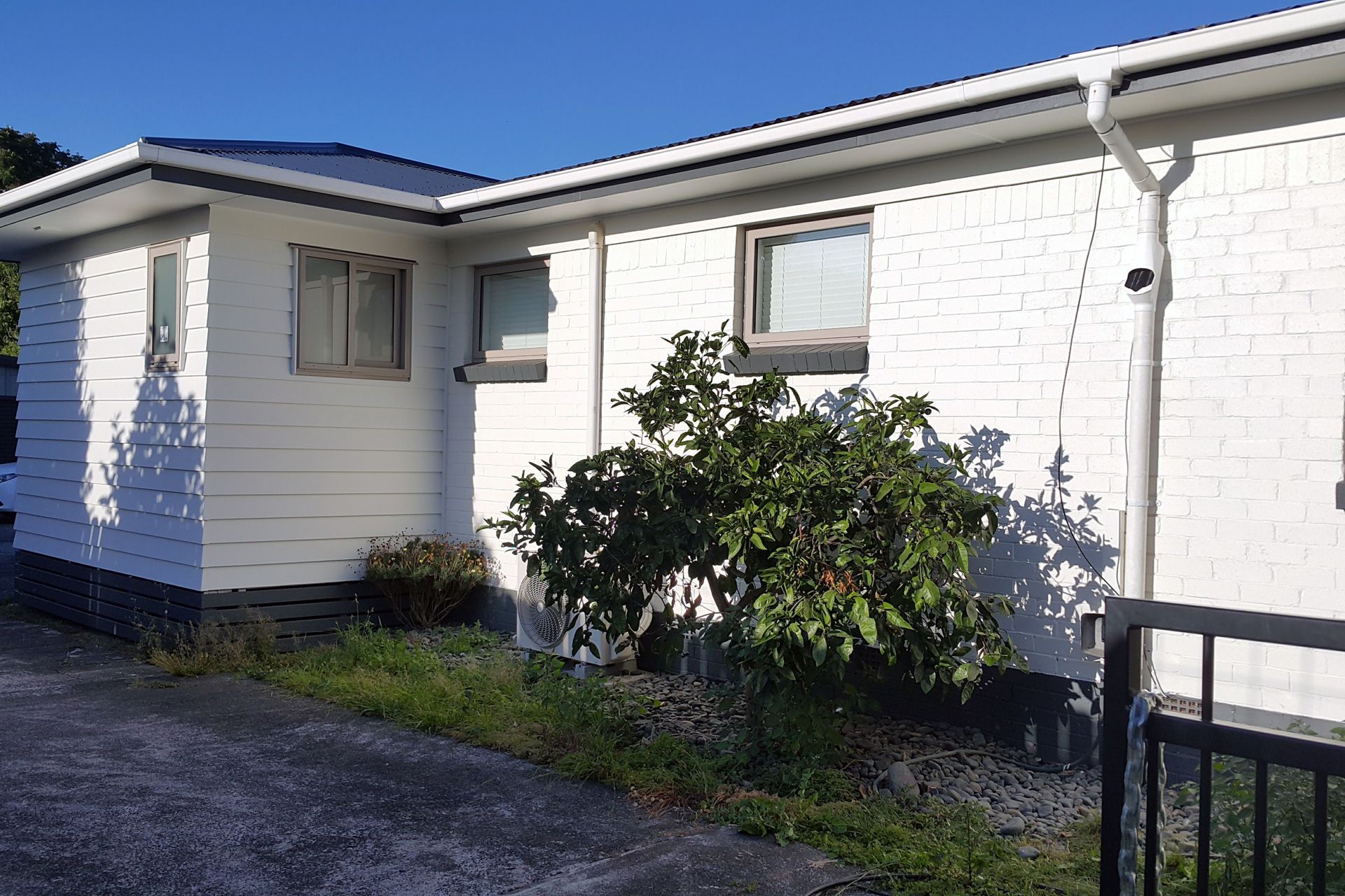 From red brick to white weatherboard brick combo 
