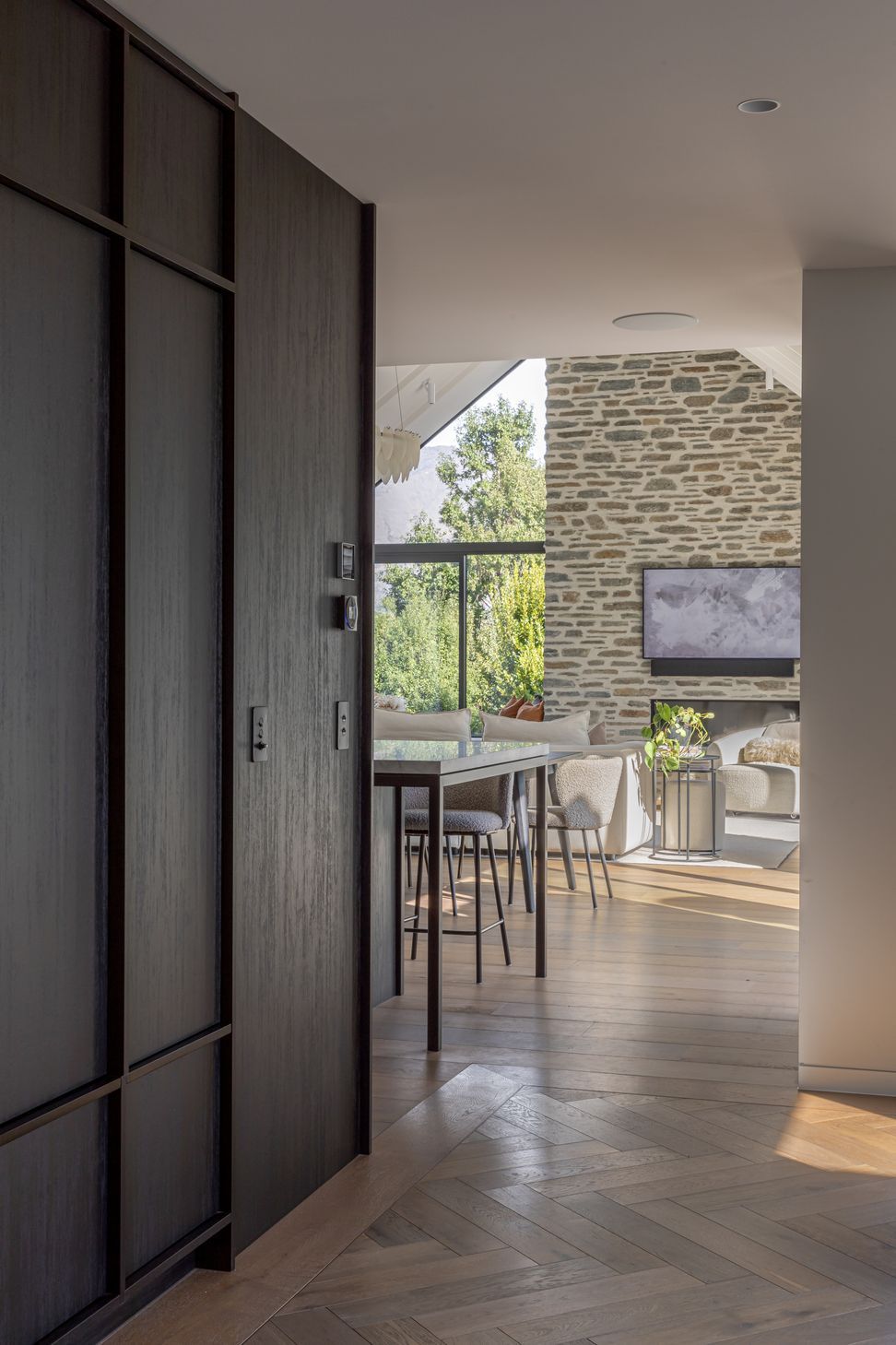 Dark natural timber joinery and parquet flooring in the entry hall