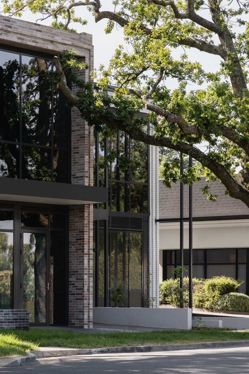 Contrasting coloured brick defines the commercial &amp; residential sides of the building