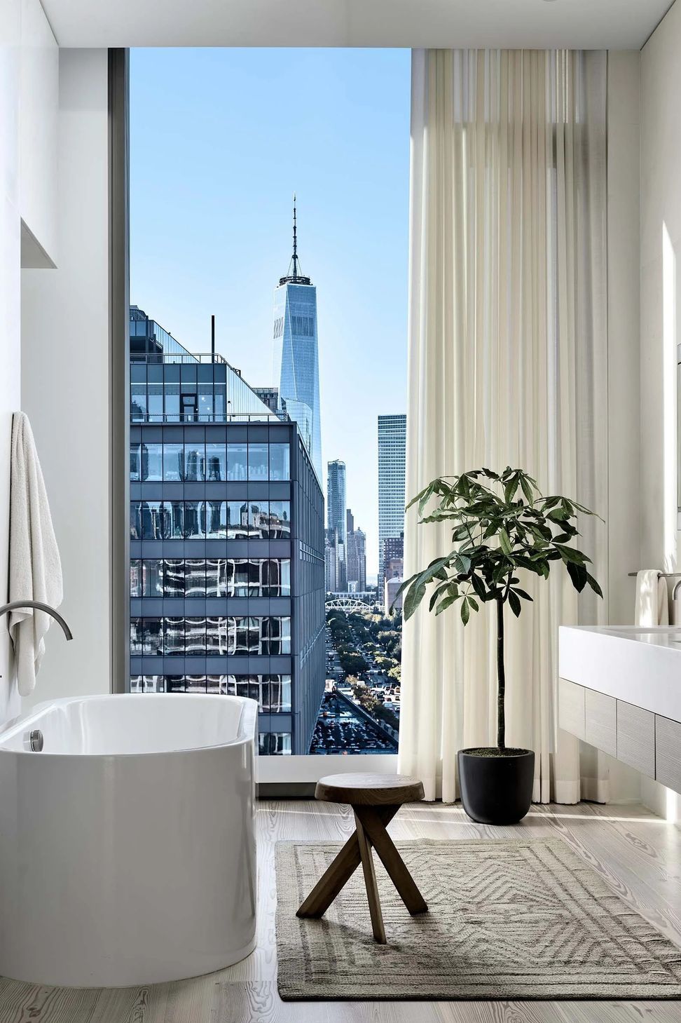 hudson-river-penthouse-bathroom-soaking-tub-floor-to-ceiling-window-skyline-view-ap-compressed.jpg
