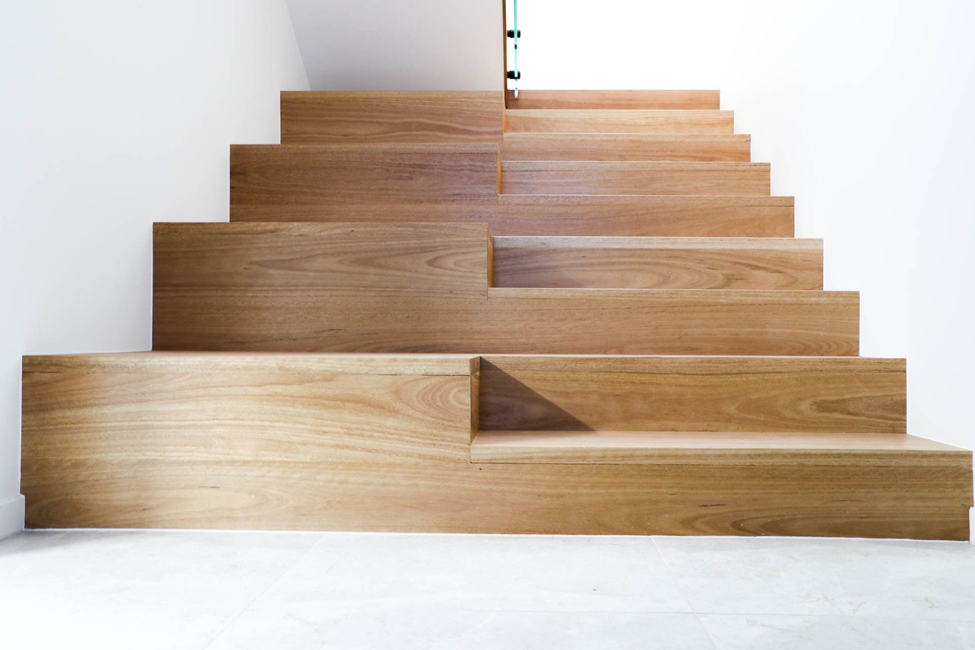 Anderson Residence - Staircase. Chunky timber stair treads against white walls.