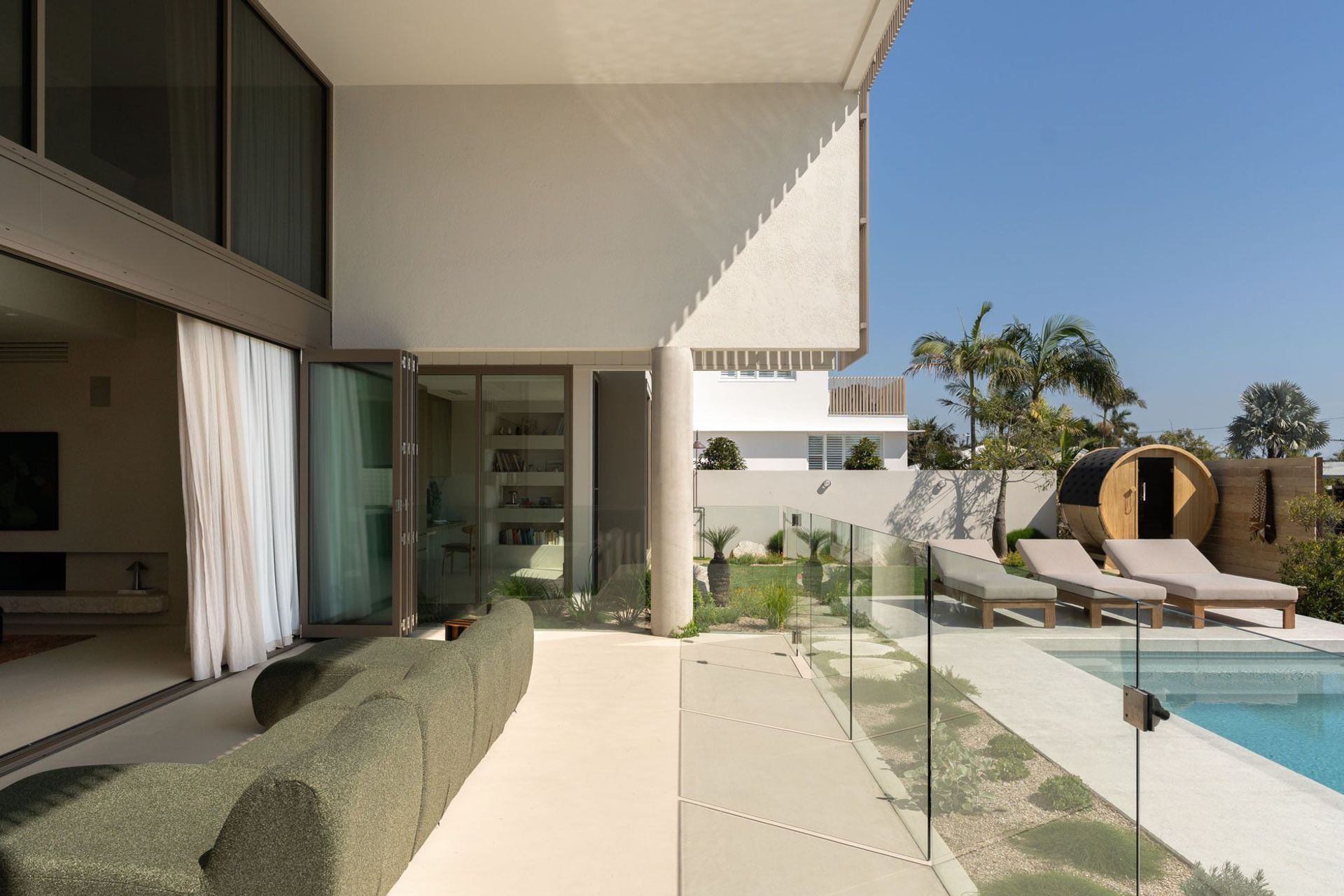 House on Pacific - Patio. Living room opening out to the pool terrace and garden.