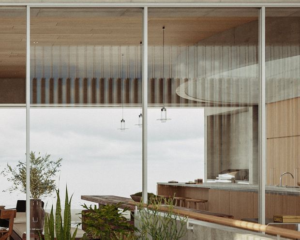 A refined contemporary kitchen and dining area viewed through expansive floor-to-ceiling glazing. Warm timber lining covers the ceiling and cabinetry, with a long stone island or benchtop, timber stools, pendant lights, and extensive indoor planting. The glazing reflects the surrounding landscape and sky, while a vertical timber screen adds texture and privacy.