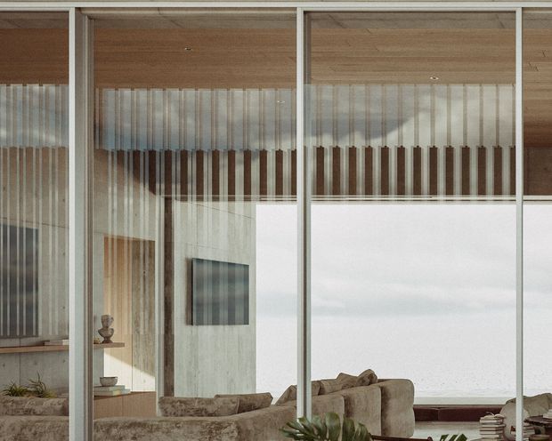 A contemporary interior viewed through full-height glazing, showing a warm timber ceiling, slim light-coloured window frames, sheer vertical curtains, a concrete-textured wall, built-in shelving, and a neutral upholstered seating area. The glazing reflects the room and an overcast exterior, creating a layered, calm composition.