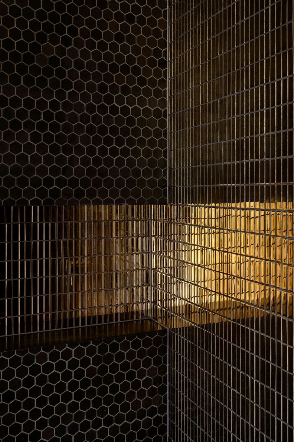 A gold tile was chosen to give the bathroom some "bling".