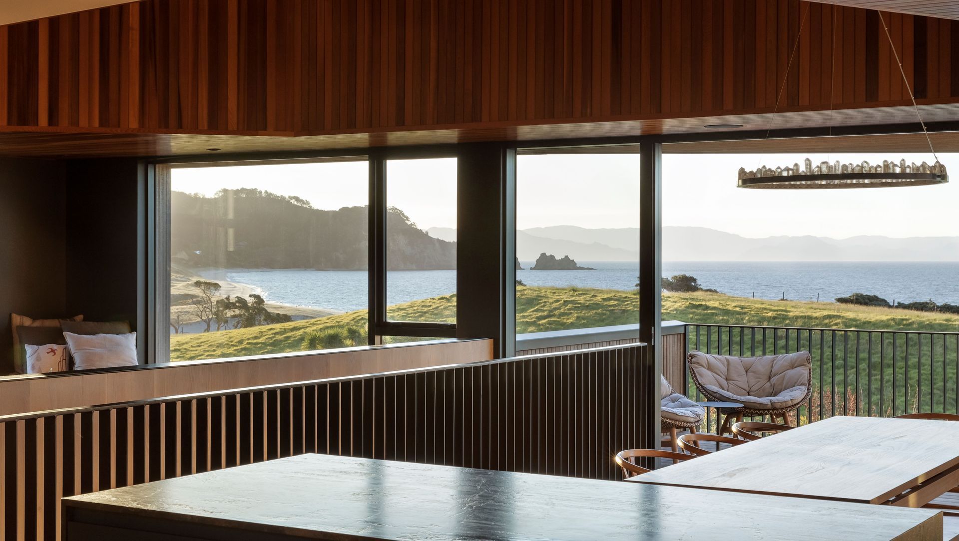 A richly textured beach home with views from hill to horizon banner