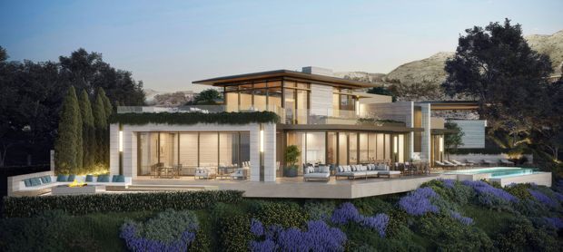 Architectural rendering of a large contemporary multi-level residence set into a landscaped hillside. The home features extensive floor-to-ceiling glazing, projecting flat roof planes, warm timber-toned soffits and wall finishes, pale stone or concrete volumes, broad terraces, and a long swimming pool. Dense ornamental planting surrounds the building, with rocky hills visible behind it.