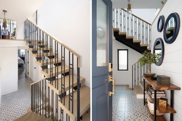 A bright contemporary residential stairwell and entry hall shown from two related viewpoints. The space features an open staircase with light timber treads, slim black metal balustrades, pale wall panelling, patterned ceramic floor tiles, and a narrow timber console with decorative mirrors and plants. A glazed front door and hallway openings are visible, with a bedroom glimpsed beyond the stairs.