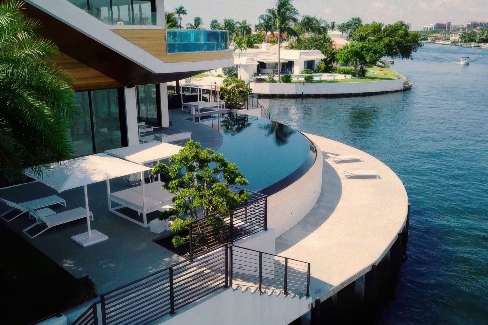 imgi19tropical-modern-architecture-second-story-pool-and-rounded-waterfall-edge-pool-gigapixel-standard-v2-2x.jpg