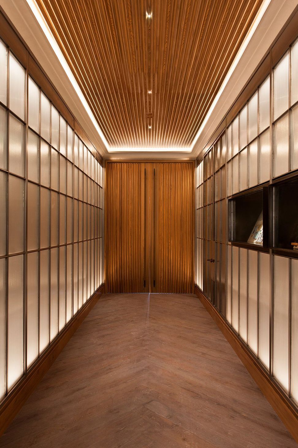 cravotta-interiors-cypress-lounge-entrance-polished-steel-reeded-glass-san-antonio.jpg