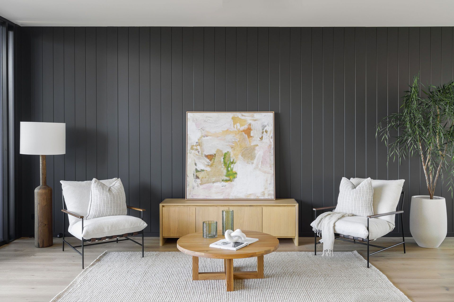 Gilbert Residence - Living Room. Lounge setting against a dark battened feature wall.