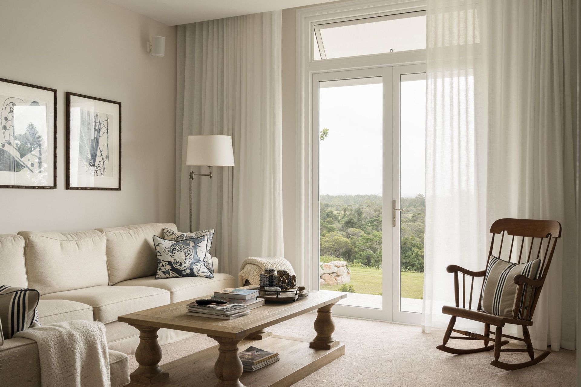 Euroa Farm - Living Room. Light filled living room with a rocking chair and French doors.