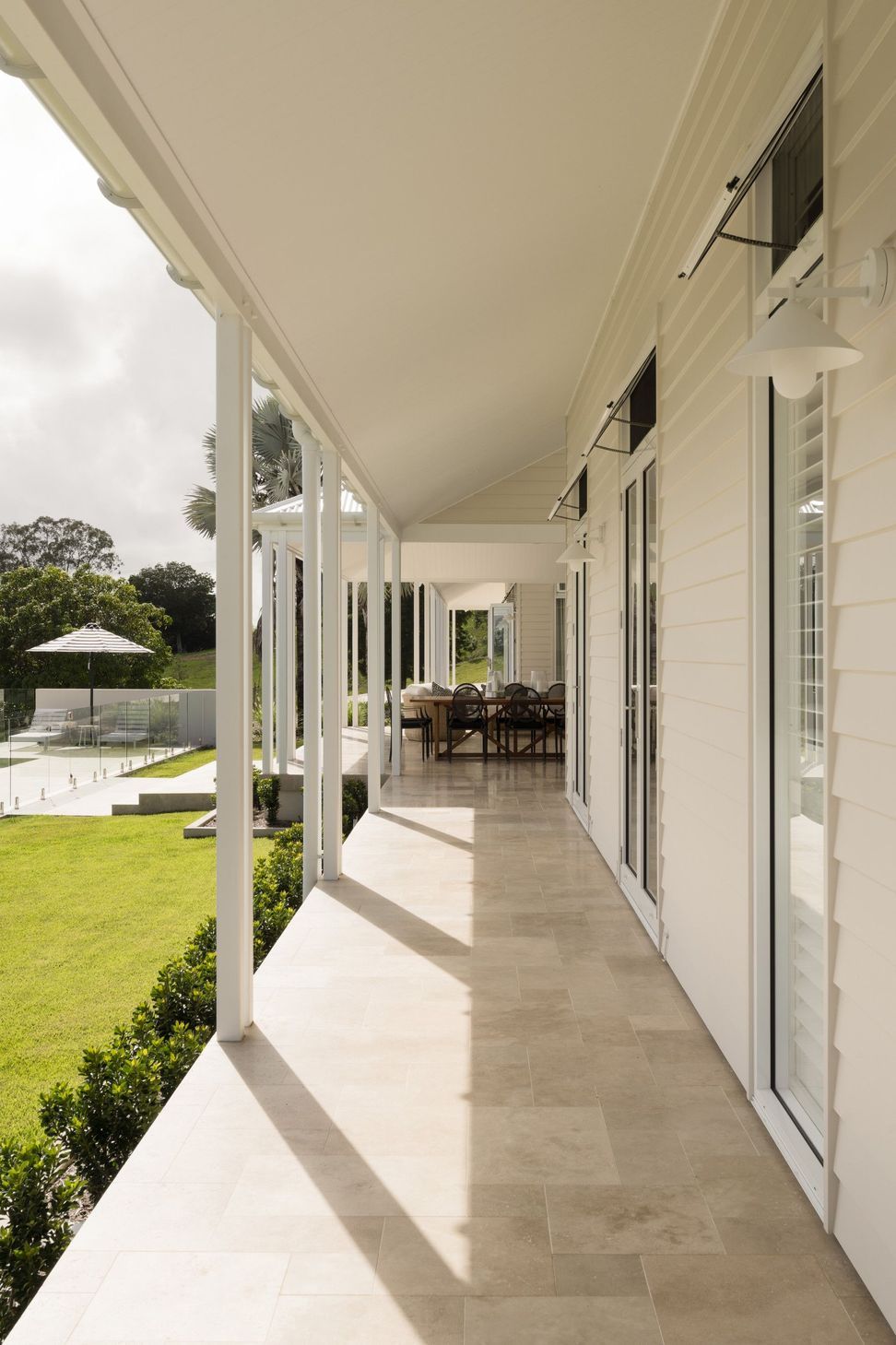 Euroa Farm - Patio. Verandah looking along to the pool and dining.