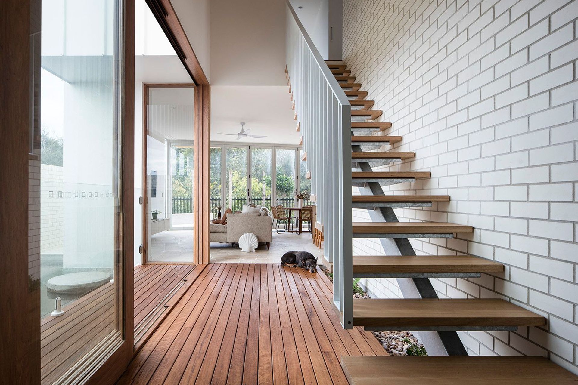 Viner Residence - Staircase. Floating timber stair beside the living room and deck.