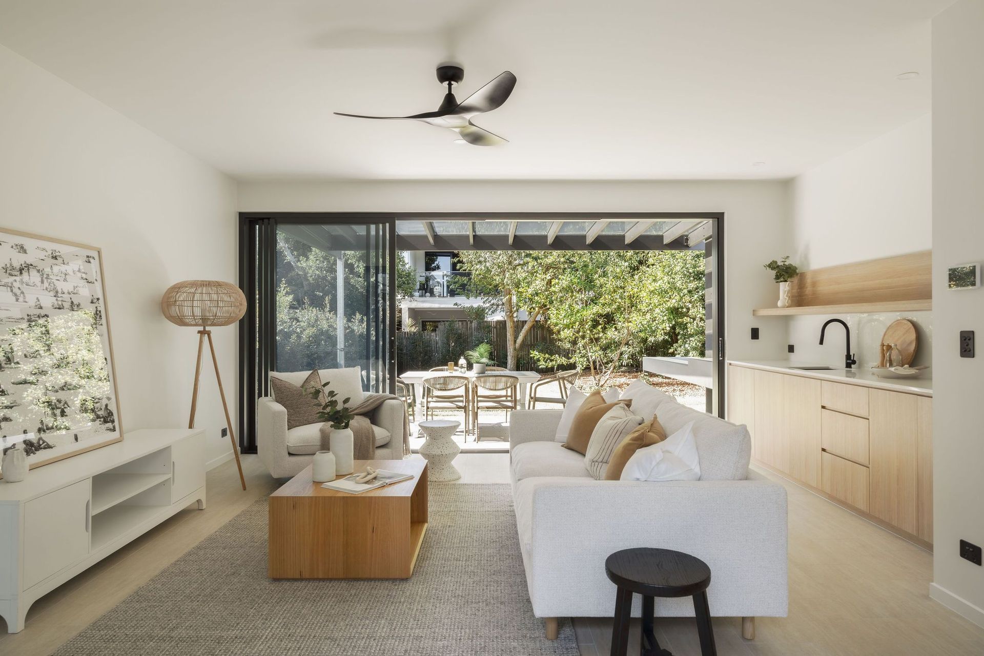 Gilbert Residence - Living Room. Open plan living opening to the outdoor terrace.