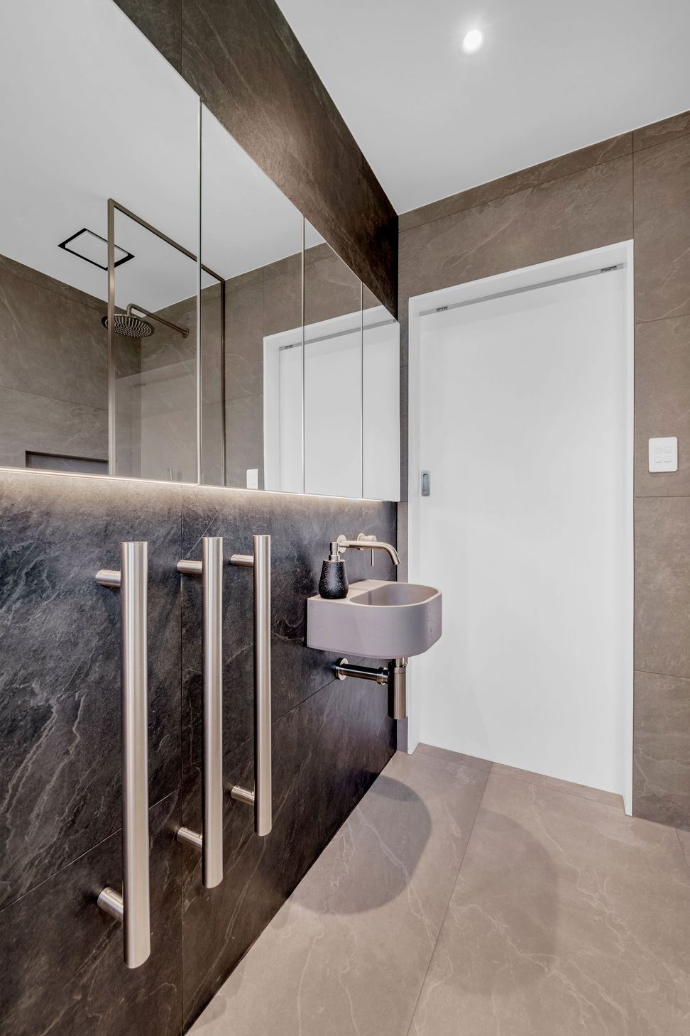 From grout lines to tapware placement, every millimetre is intentional.