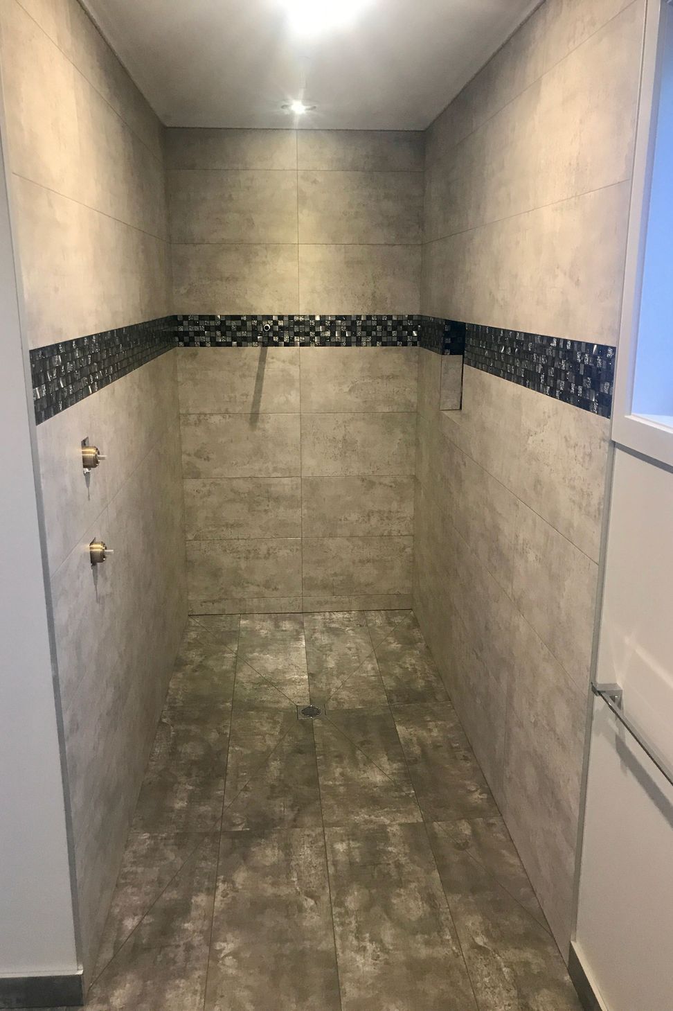 Tiled shower wall &amp; floors