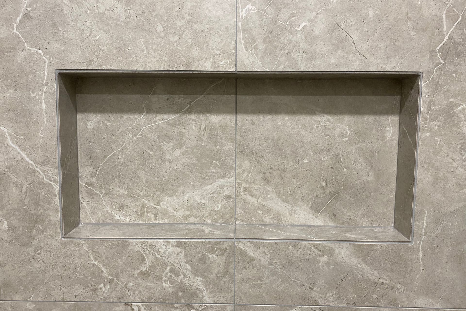 Tiled shower wall niche