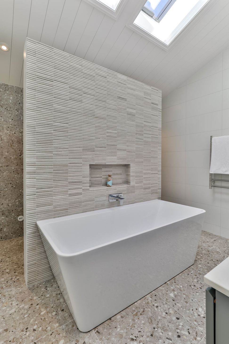 TILE DEPOT / Tiles: Colosseum Travertine 305x305mm, Blanco Brillo Matt 300x600mm, Frammenta Taupe 597x597mm / Tap: Olympia Wall Mounted basin Mixer Chrome