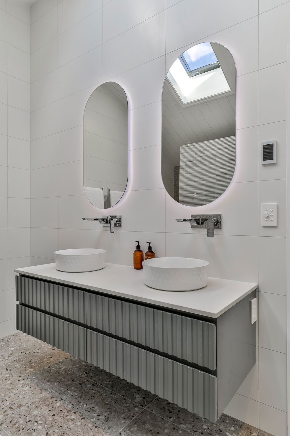 TILES & BATHWARE SUPPLIED BY TILE DEPOT .  Vanity: Customised AIntree Wall Hung 1500mm / Basins: Radial 355 textured white / Mirrors: Ambience Back Lit Mirror Pill 500x1000H
