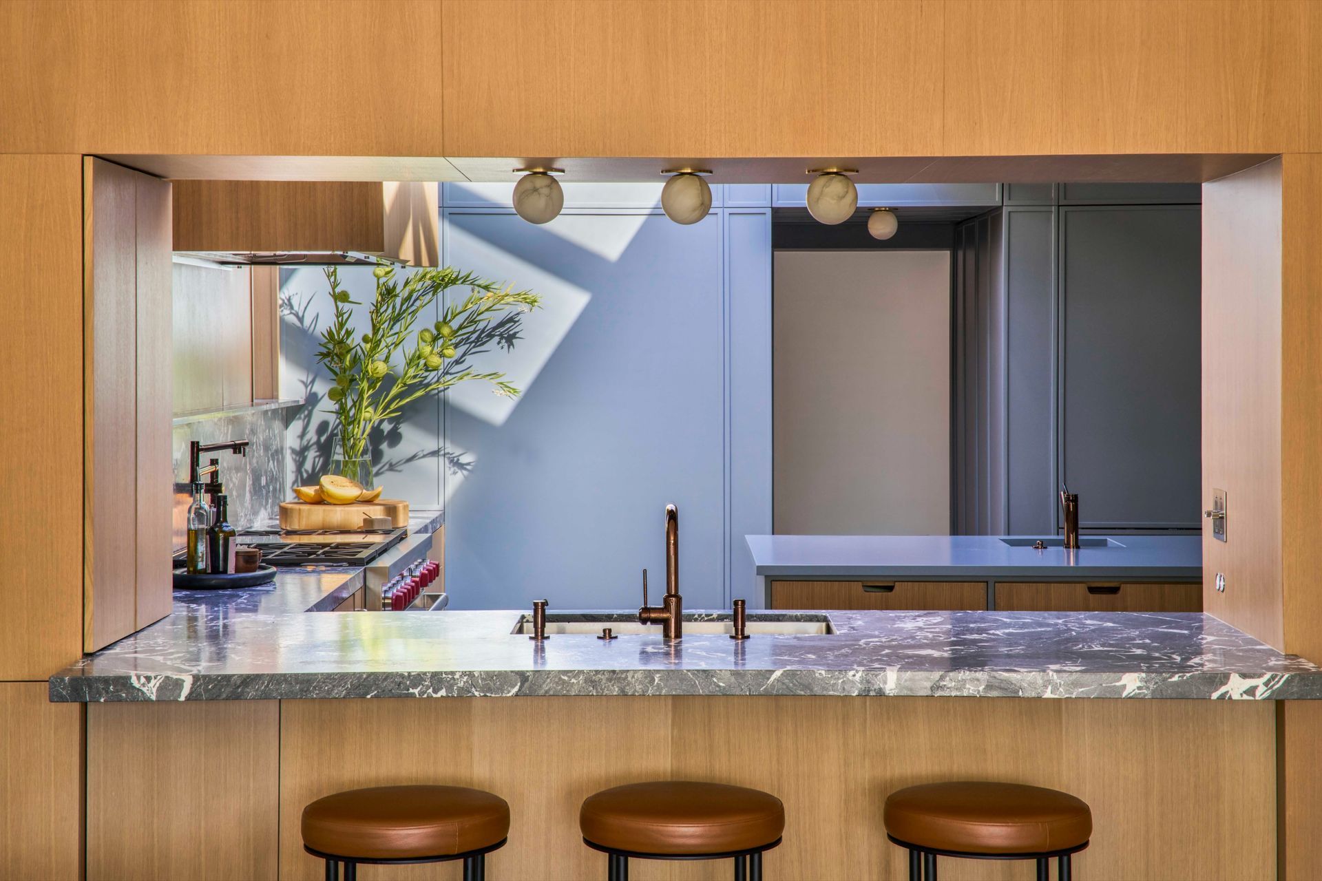 dona-marta-the-warren-interior-design-mid-century-modern-kitchen-pass-through-alabaster-globe-lights-24-studio-city-ap-compressed.jpg