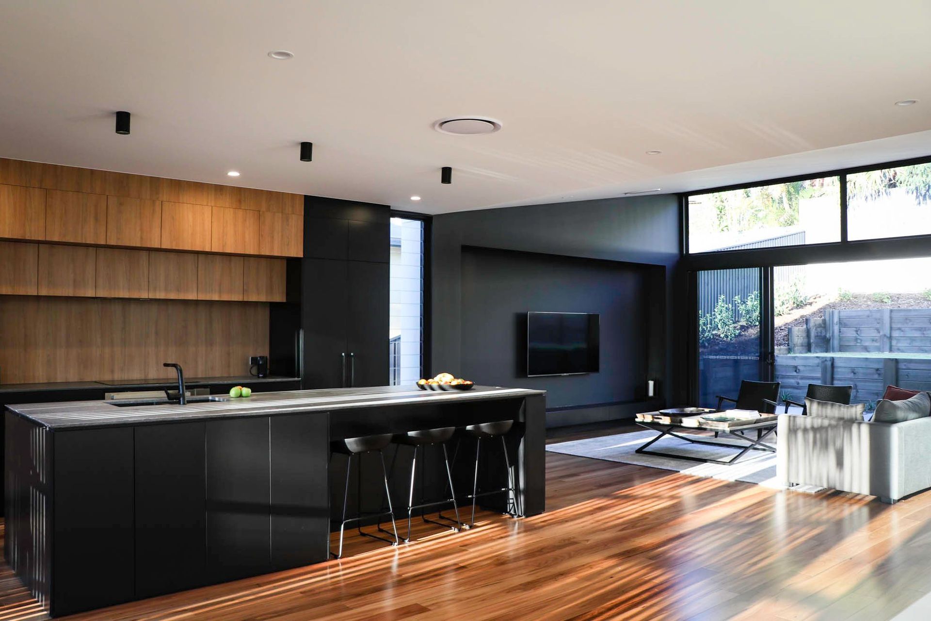Glennon Residence - Kitchen. Open plan kitchen and living with timber floors.